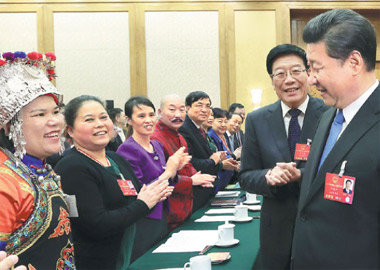 President Xi Jinping talks with female delegates from Hunan