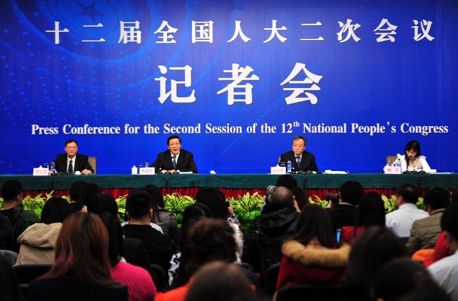 Chinese Finance Minister Lou Jiwei (2nd L, back) and vice Finance Minister Zhang Shaochun (2nd R, front) give a press conference for the second session of China's 12th National People's Congress (NPC) on fiscal and tax reform, in Beijing, capital of China, March 6, 2014.(Xinhua/Xiao Yijiu)