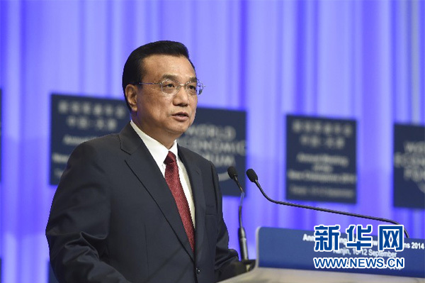 9月10日，2014夏季达沃斯论坛开幕式在天津梅江会展中心举行，国务院总理李克强出席并致辞。图为李克强总理进行开幕致辞。新华社记者 李学仁 摄